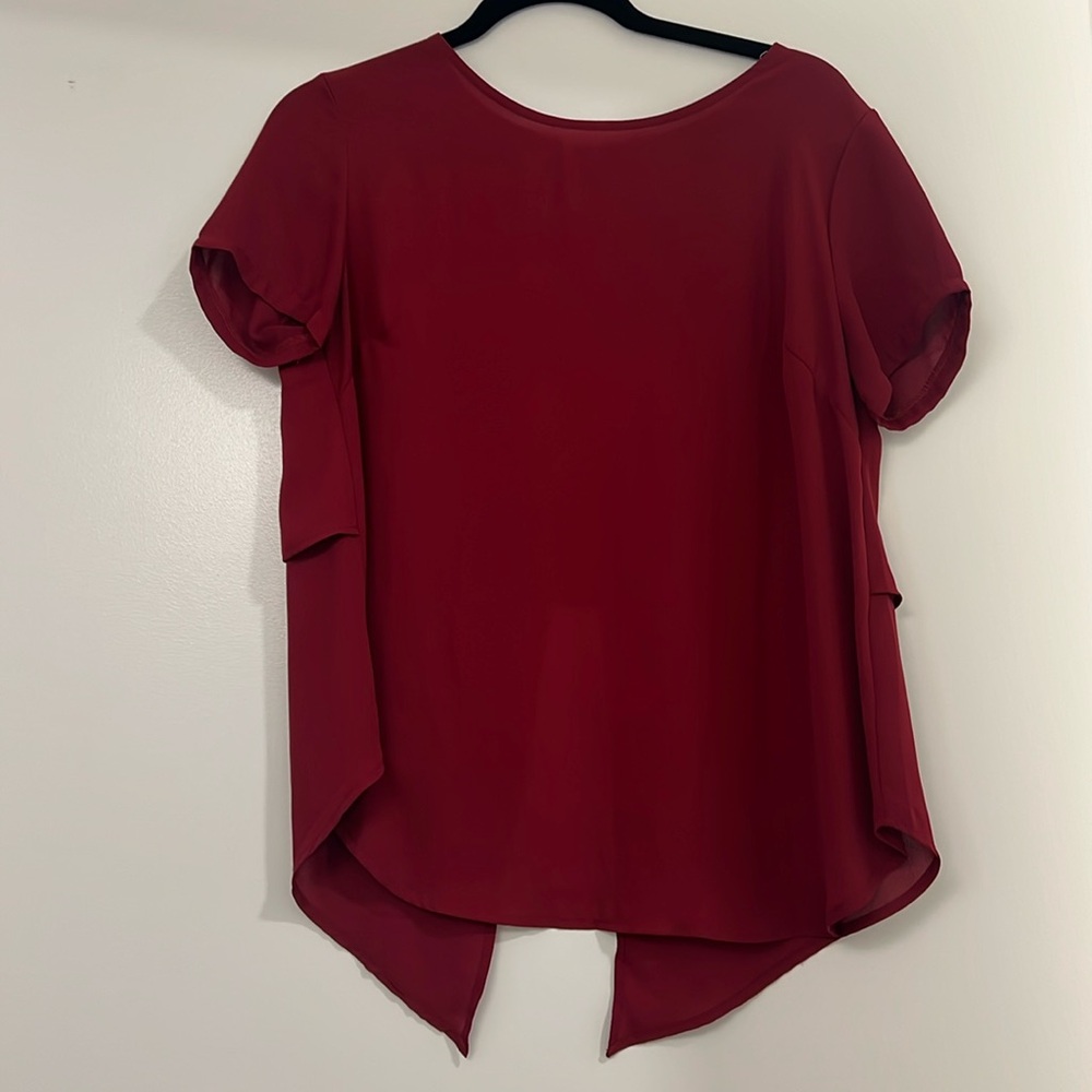 Red flowy top with small lower back opening